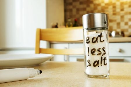 salt shaker that says eat less salt on it