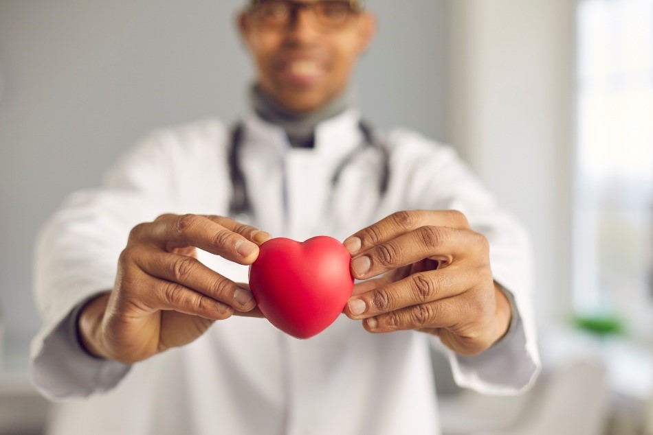 doctor holding a hear shaped item