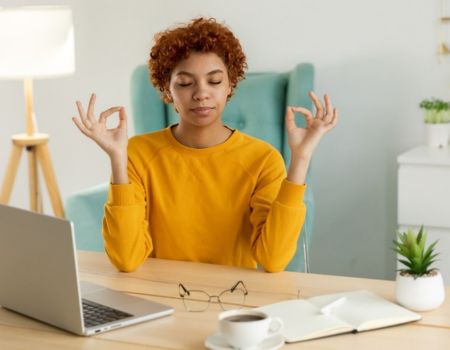 woman taking a break from work to meditate