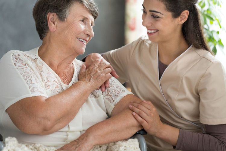 caregiver comforting a patient with Alzheimer's 