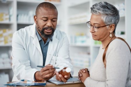 pharmacist going over medicatiion