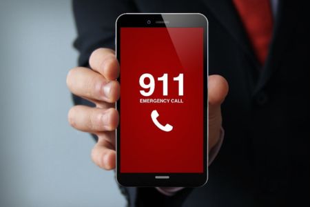 image of a man holding a phone facing out that reads 911 in red