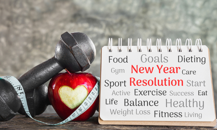 image of a dumbbell, tape measurer and apple with a heart image in it next to a sign of resolutions