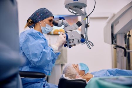 doctor about to perform laser eye surgery on prepped patient