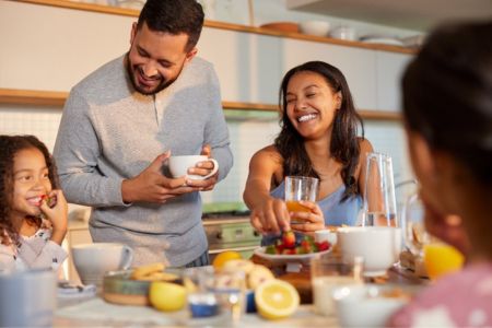 family eating healthy snacks around a table