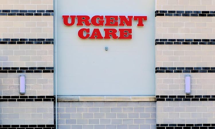 Image of a sign that reads "urgent care" on the side of a building 