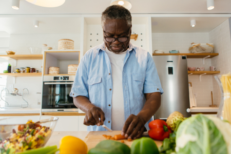 man preparing a meal in his kitchen 