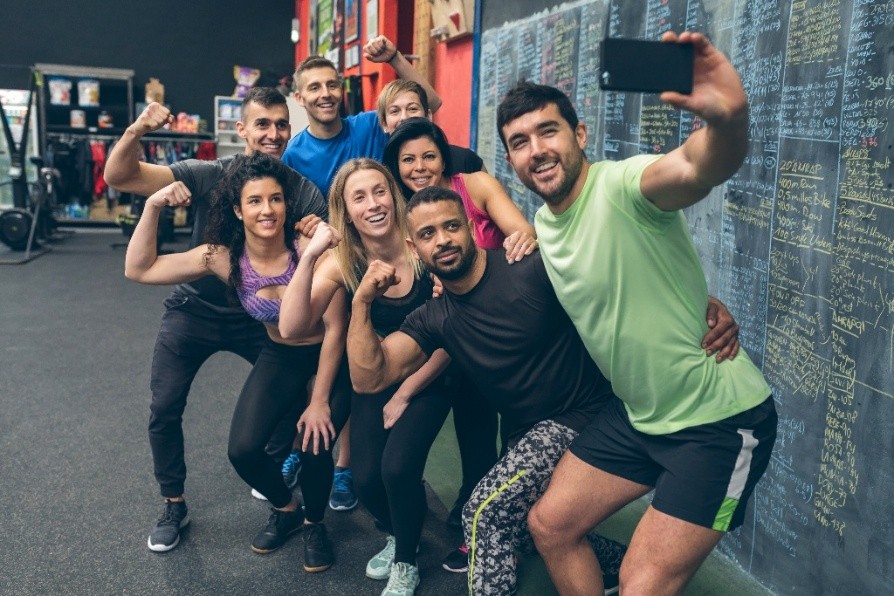 A group of people posing for a picture after working out