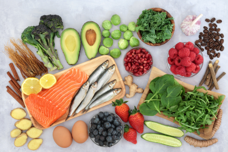 Image of anti-inflammatory food choices, including fish, beans, vegetables, and fruits.